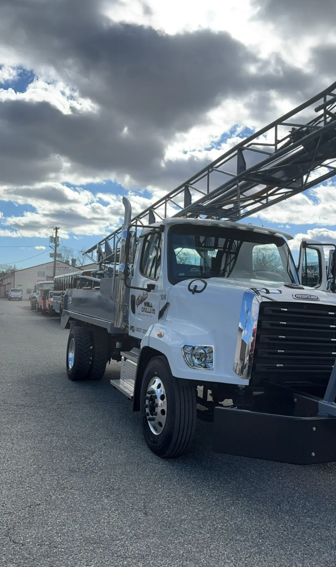 Delsea Freightliner drill truck under a cloudy South Jersey sky